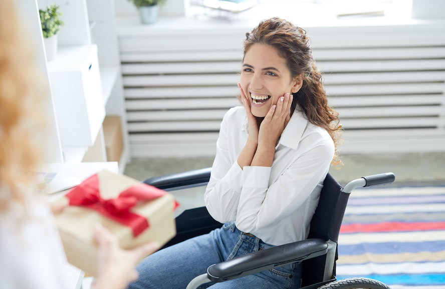 Happy girl on wheelchair - Cloud of Goods